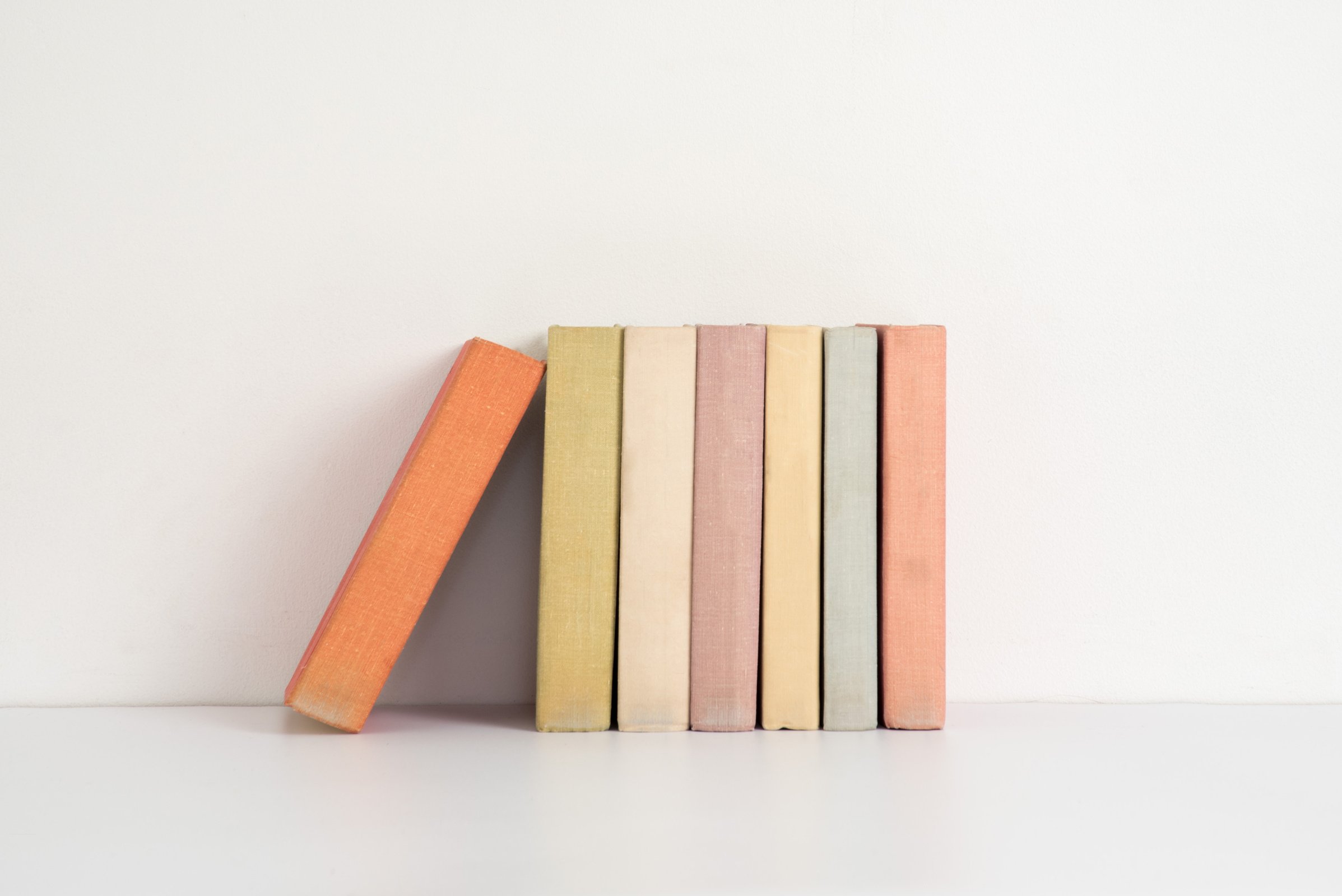 Colorful Hardback Books on the Shelf